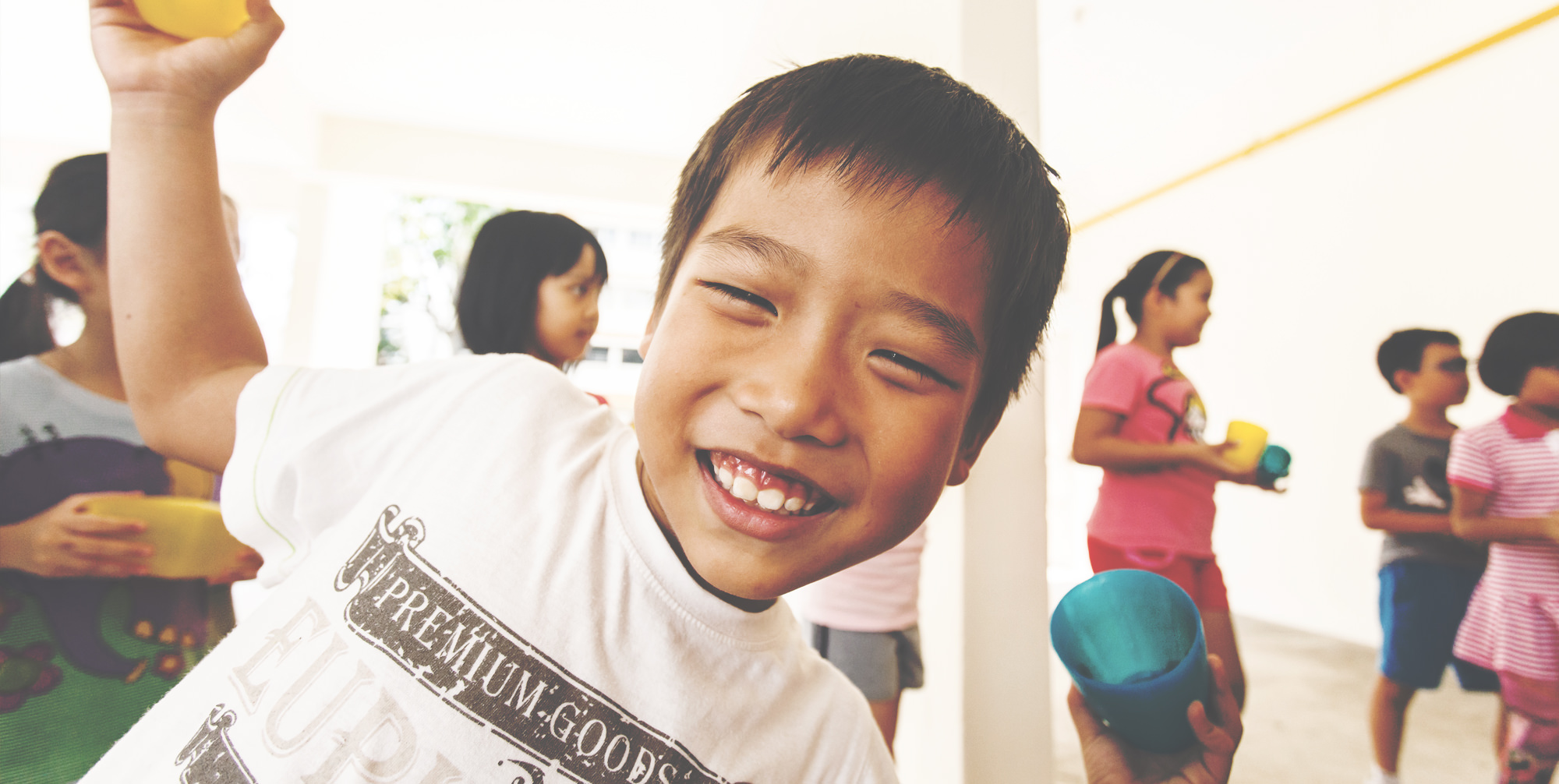 Smiling Life Community child with other children in the background